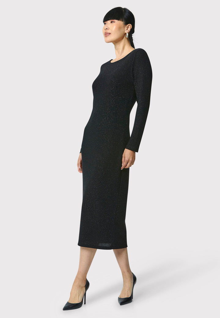 Introducing the Jamie Black Shimmer Dress, an elegant bodycon piece with full-length sleeves. Made from sparkly black jersey fabric, it features a slash neck with a slight V-back for added allure. Its midi length perfectly balances classic and modern styles. Ideal for any occasion, this dress adds a touch of glamour to your look.