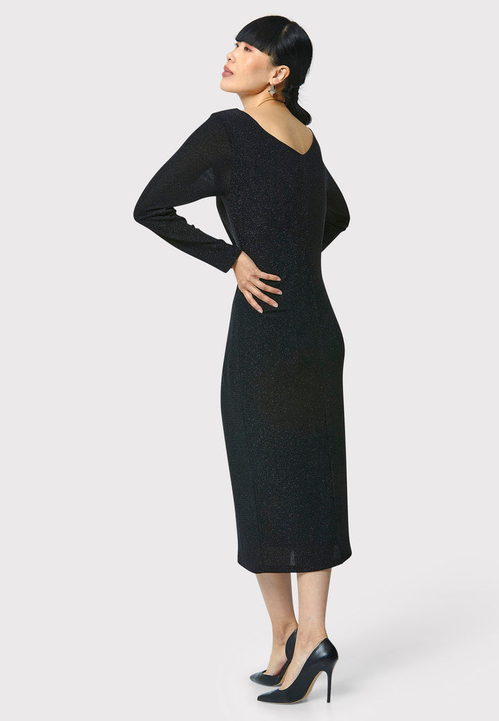 Introducing the Jamie Black Shimmer Dress, an elegant bodycon piece with full-length sleeves. Made from sparkly black jersey fabric, it features a slash neck with a slight V-back for added allure. Its midi length perfectly balances classic and modern styles. Ideal for any occasion, this dress adds a touch of glamour to your look.
