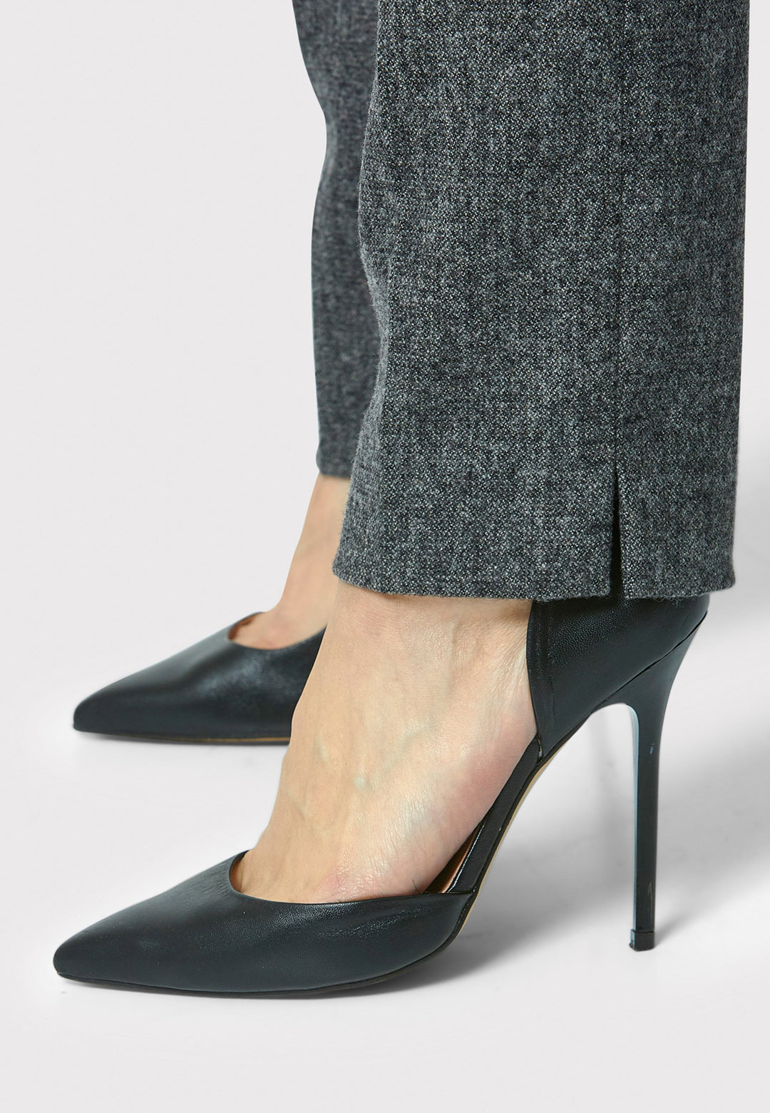 Introducing Jill in charcoal grey, made from a soft-touch wool blend. These classic narrow-leg trousers have a sleek, tailored fit and ankle-grazing length. The clean front sits naturally at the waist, with stylish details like a jet pocket and slit hem. Pair with the Cassie Charcoal Grey Blazer.