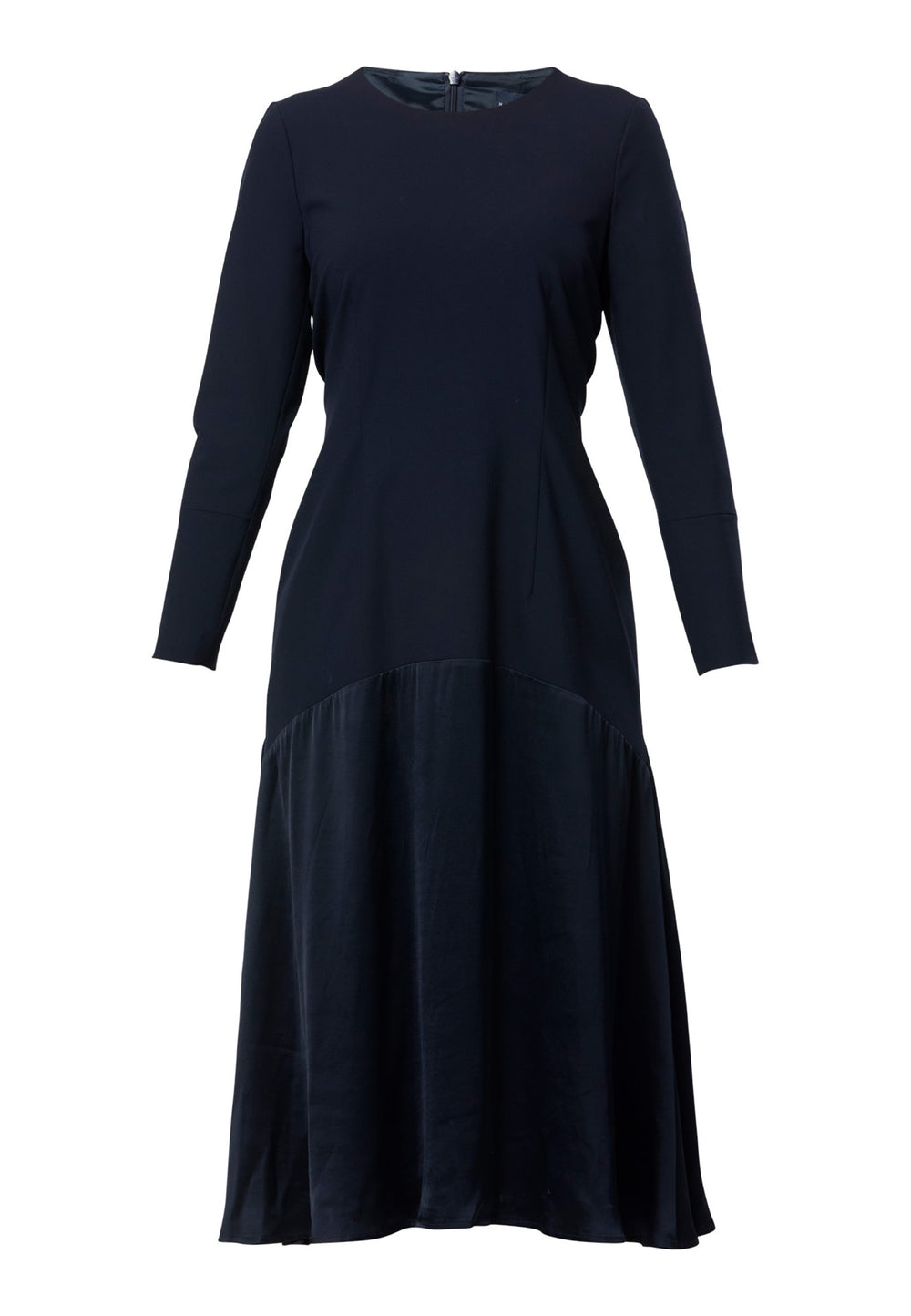 Kristy, a modern take on the dropped waist. Cut from plain-weave worsted navy fabric with a touch of stretch, the dress contrasts with a fluid viscose satin skirt that flows softly from the low hip. Designed with a clean round neckline, long fitted sleeves, a dropped waistline and a gently flared midi skirt that falls to mid-calf. The tonal fabric pairing creates subtle dimension, while the detachable satin scarf/belt can be cinched at the waist or draped elegantly around the neck. 