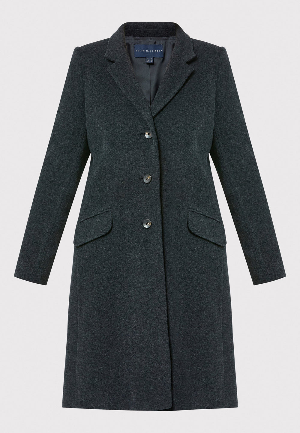 The Leighton charcoal grey coat is crafted from a luxurious wool and cashmere melton blend. Expertly crafted, this knee-length coat offers both warmth and sophistication. Drawing inspiration from refined men's tailoring, it showcases a tidy collar and revere design. With a three-button finish and practical pockets, this coat effortlessly combines functionality with style. Elevate your outerwear collection with this versatile and classic piece that will ensure you stay chic and cozy throughout the winter sea