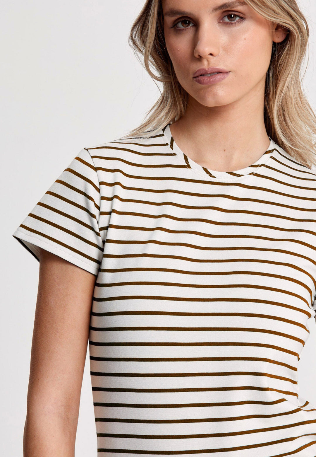Our best-selling take on a classic white tee. Luxe stretch jersey and a neat round neck make this one of our most revered essentials. Now available in a sandlewood and ecru stripe.