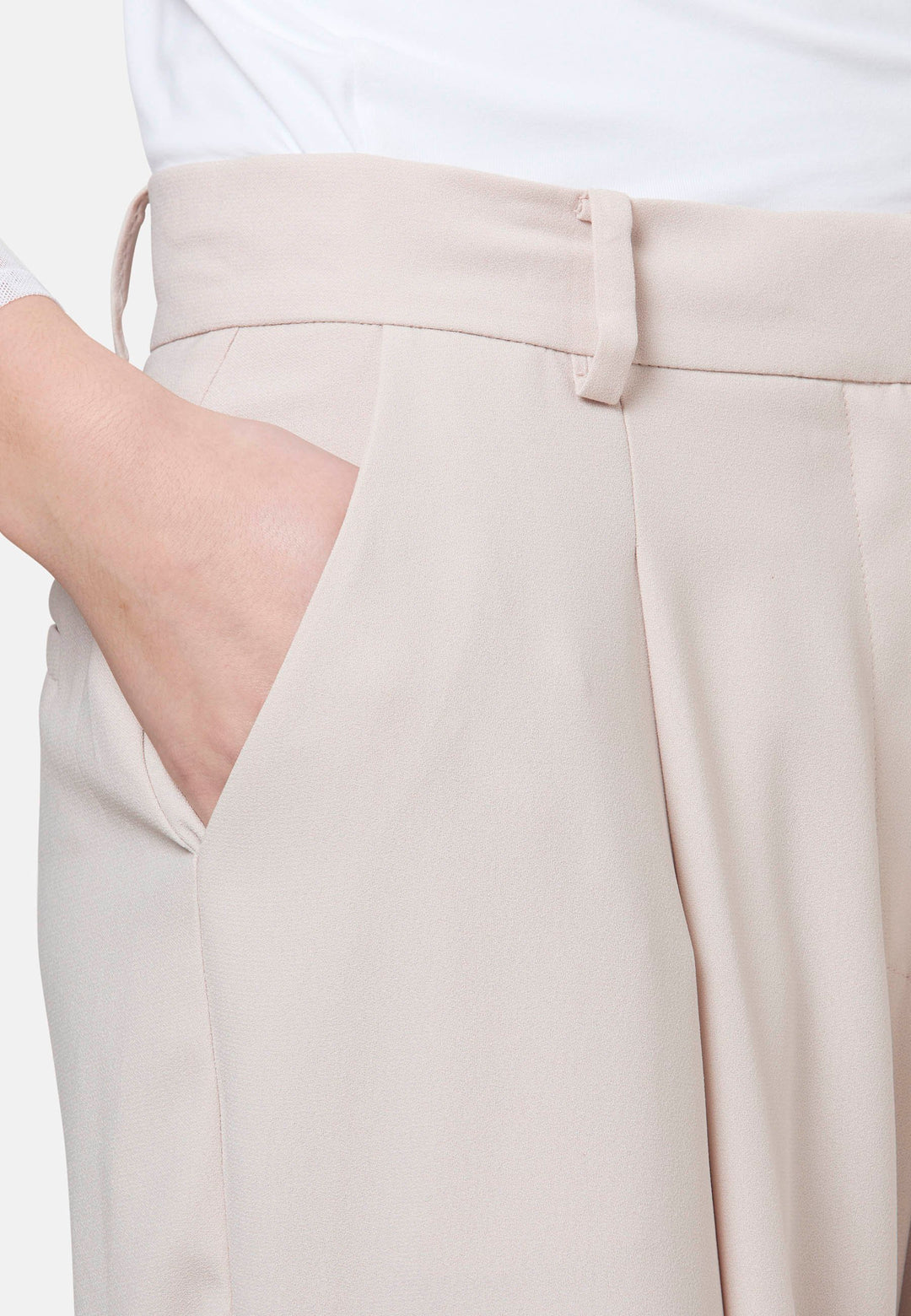 Woman wearing natural pearl pants