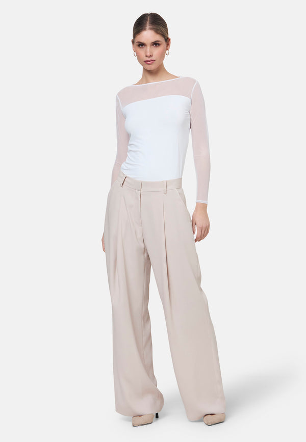 Woman wearing natural pearl pants