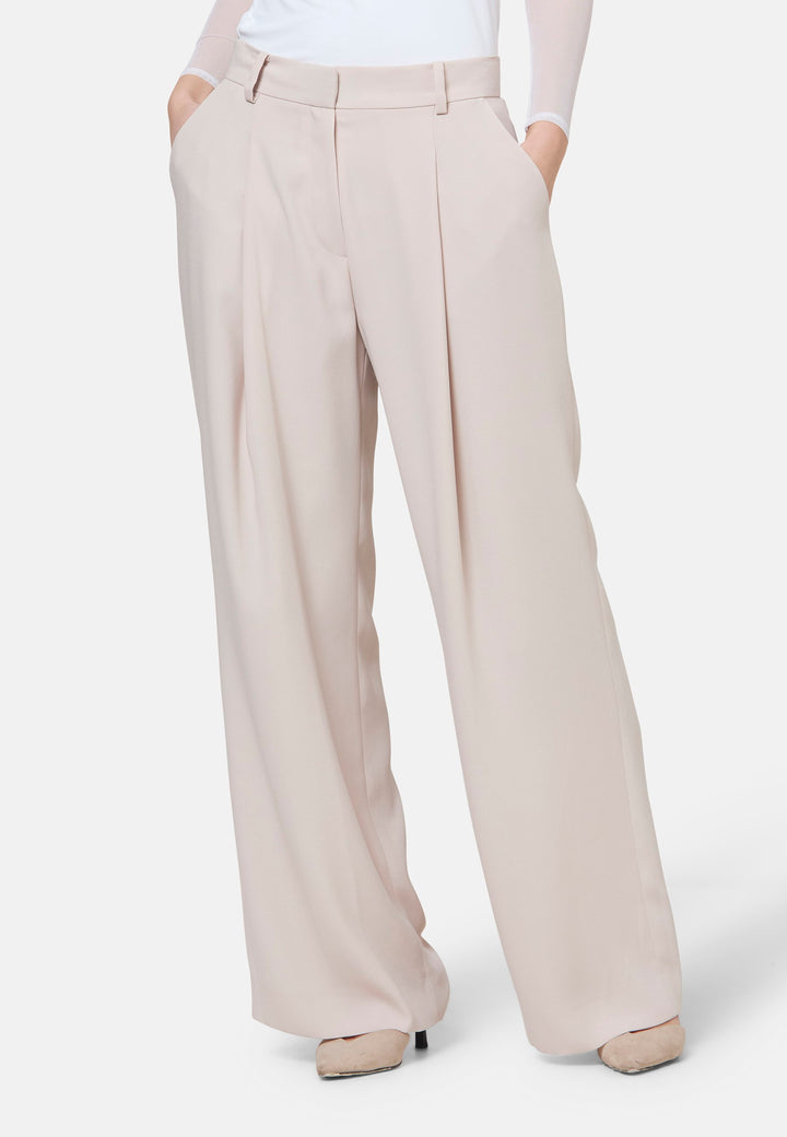 Woman wearing natural pearl pants