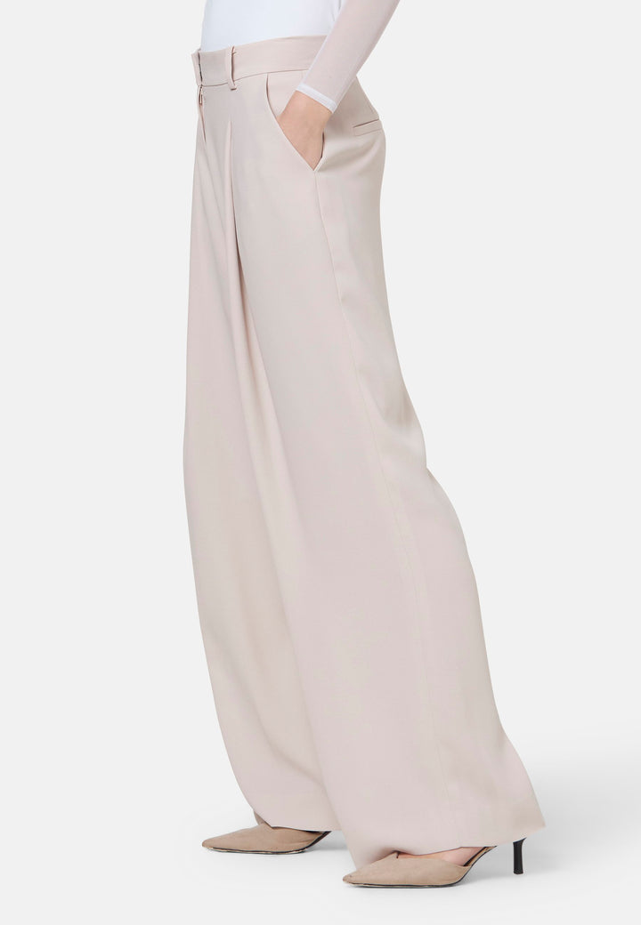 Woman wearing natural pearl pants