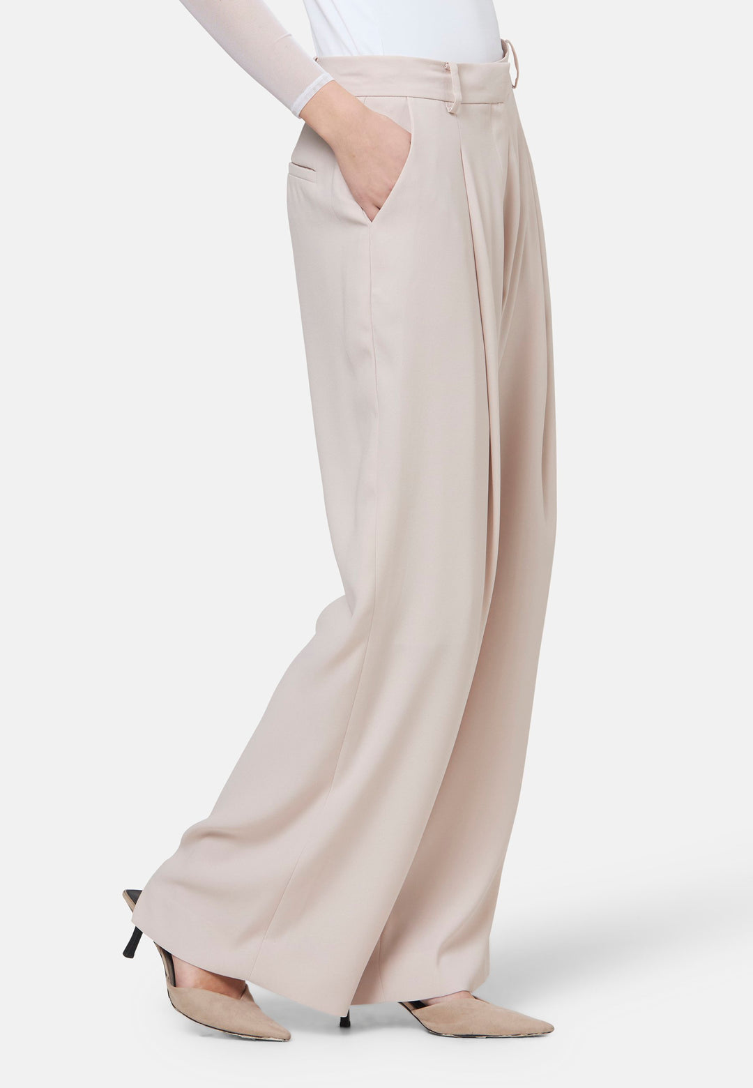 Woman wearing natural pearl pants