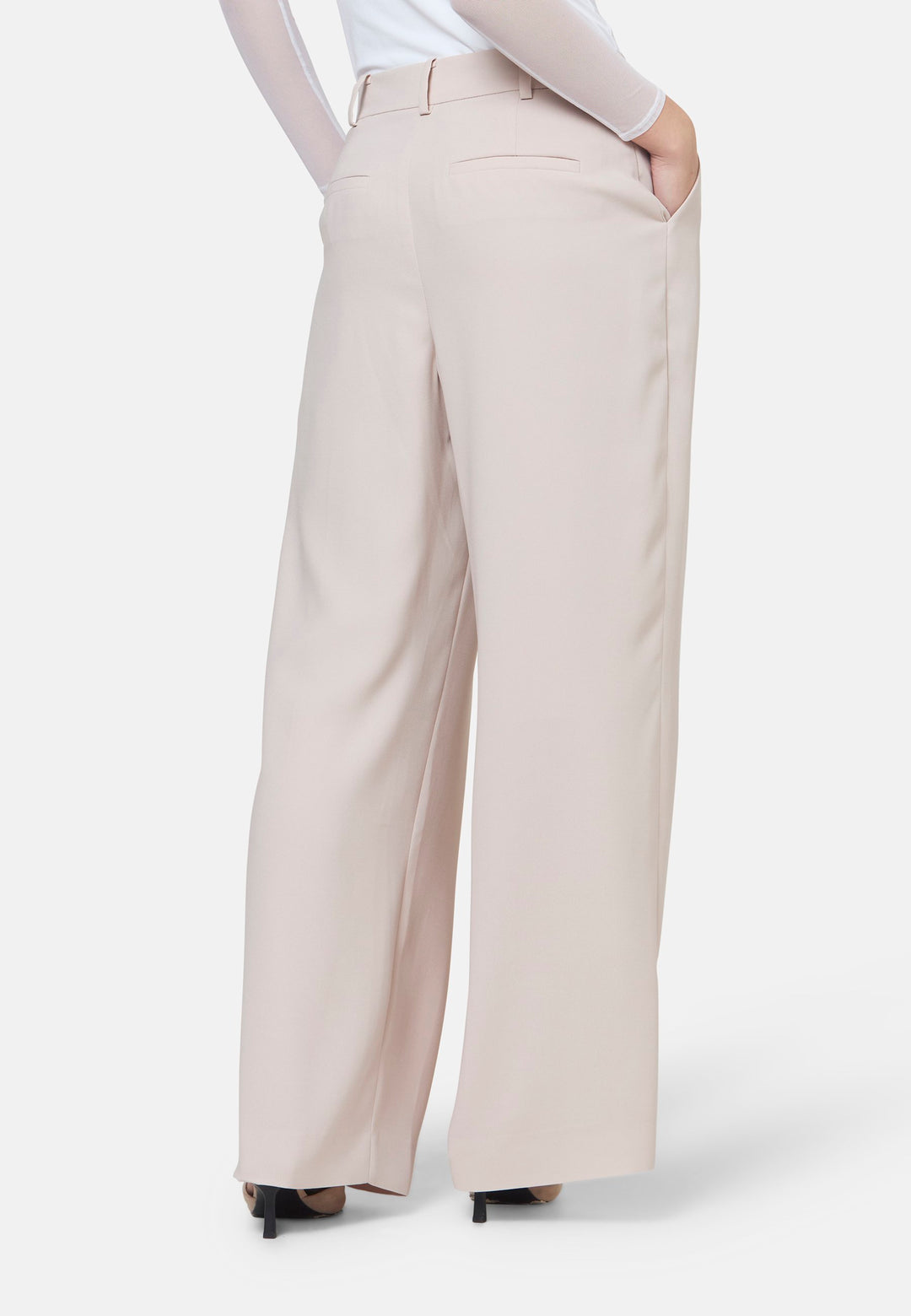 Woman wearing natural pearl pants