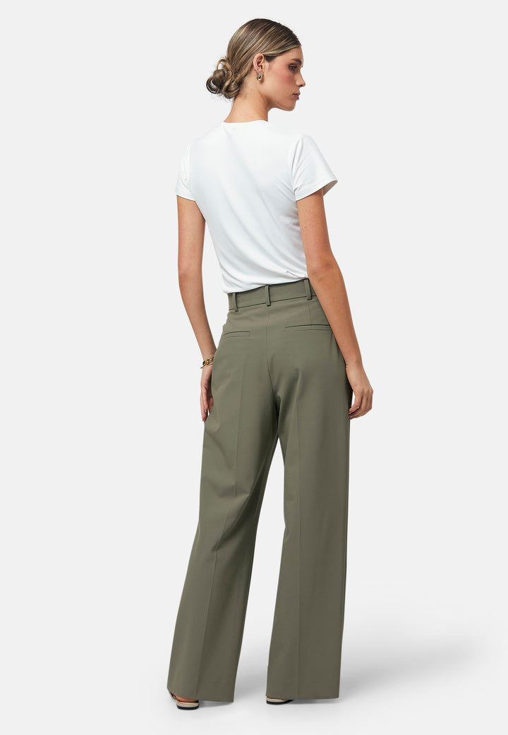 Elevate your wardrobe with the olive Lyra trousers. Designed for both comfort and style, they feature a relaxed wide-leg fit with a pleated front, offering a timeless and versatile look suitable for both professional and casual settings. Pair with a simple tee and the matching Cassie Jacket, for a sophisticated outfit.