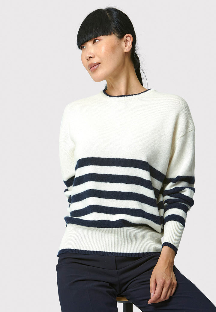 The Marine Stripe Sweater is a luxurious blend of extra fine merino wool and cashmere, ensuring a soft and warm experience.
