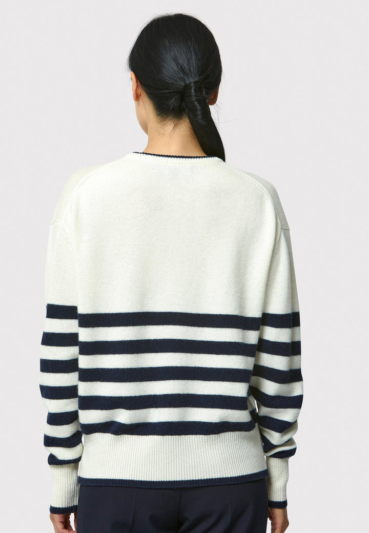 The Marine Stripe Sweater is a luxurious blend of extra fine merino wool and cashmere, ensuring a soft and warm experience.