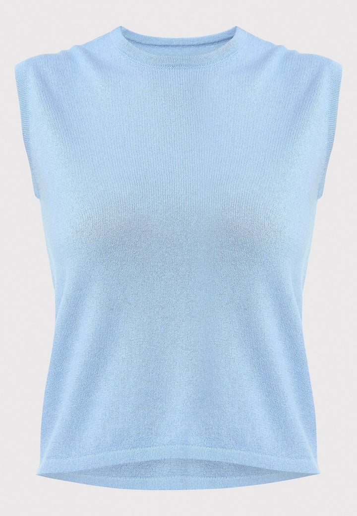 The Marlena Porcelain Blue Cashmere Sweater-Vest is a sleeveless, round-neck top that offers versatile styling options. Wear it as a simple underpinning for the matching Greta cardigan to complete a coordinated look. Alternatively, layer it as a sweater vest over your favorite crisp white shirts for a stylish and contemporary outfit. Made from luxurious cashmere, the Marlena Sweater-Vest adds an extra layer of comfort and sophistication to your wardrobe.