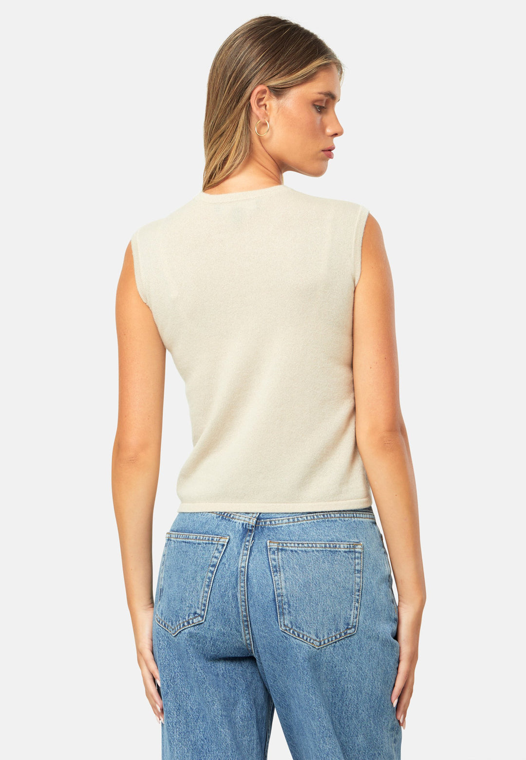 The statement sleeveless knit. Spun from pure cashmere with a cloud-soft handle, it has a neat crew neckline, clean armholes and a waist-skimming straight fit. Lightweight yet warm, it slips under blazers or wears solo with high-rise denim.