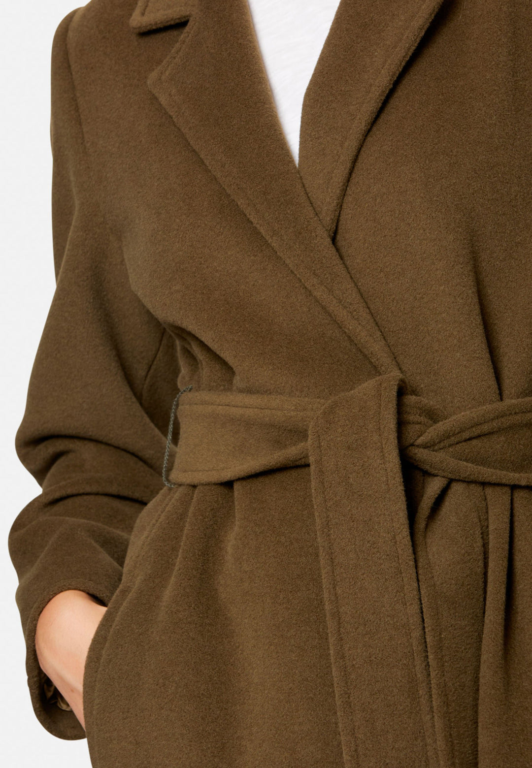 woman wearing umber brown long wool coat