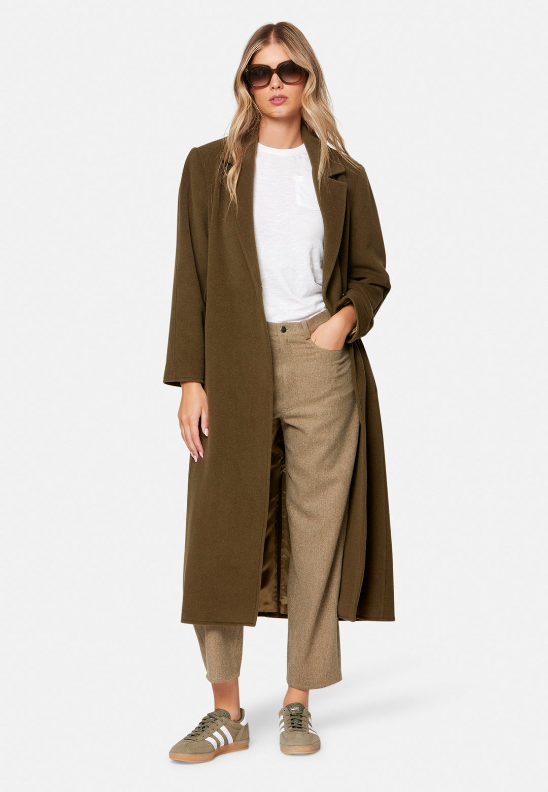 woman wearing umber brown long wool coat