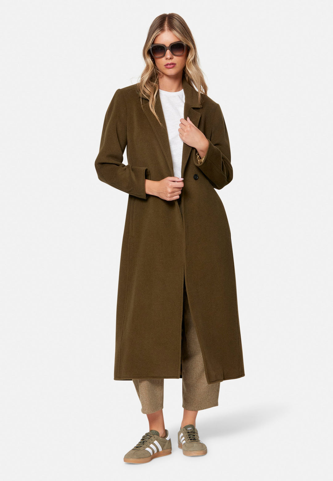 woman wearing umber brown long wool coat