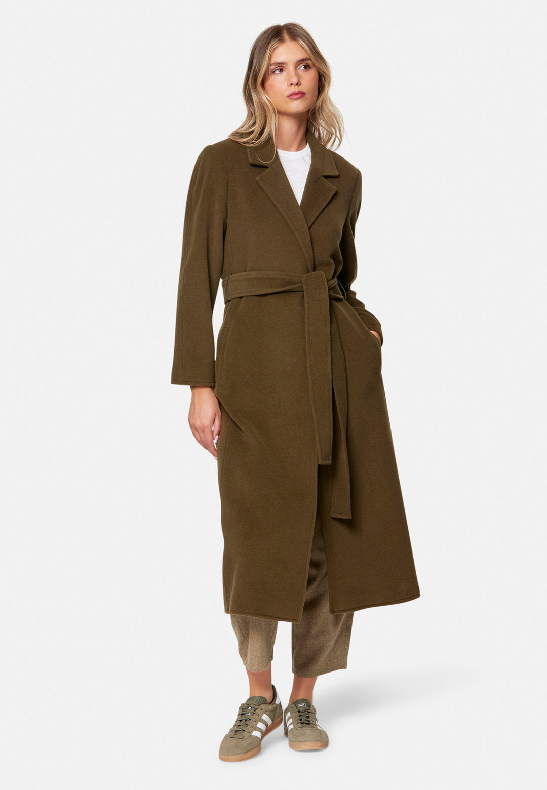 woman wearing umber brown long wool coat