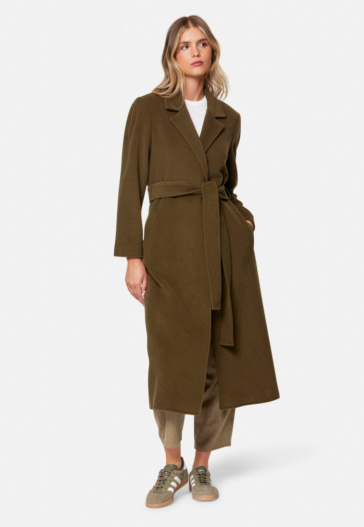 woman wearing umber brown long wool coat