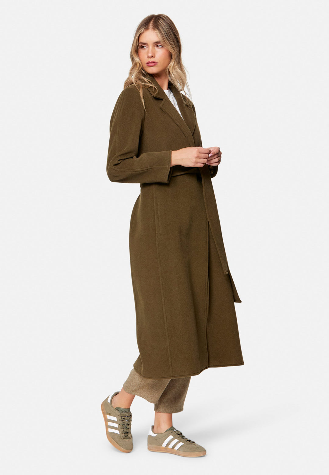 woman wearing umber brown long wool coat