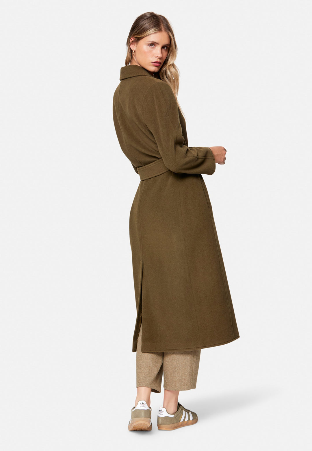 woman wearing umber brown long wool coat