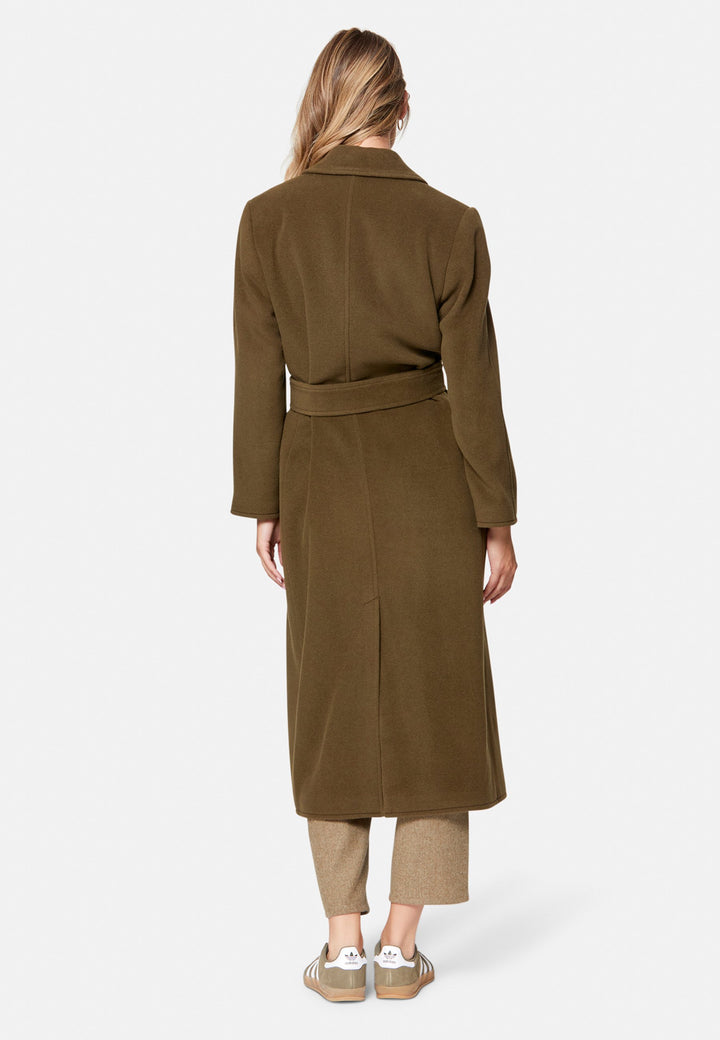 woman wearing umber brown long wool coat