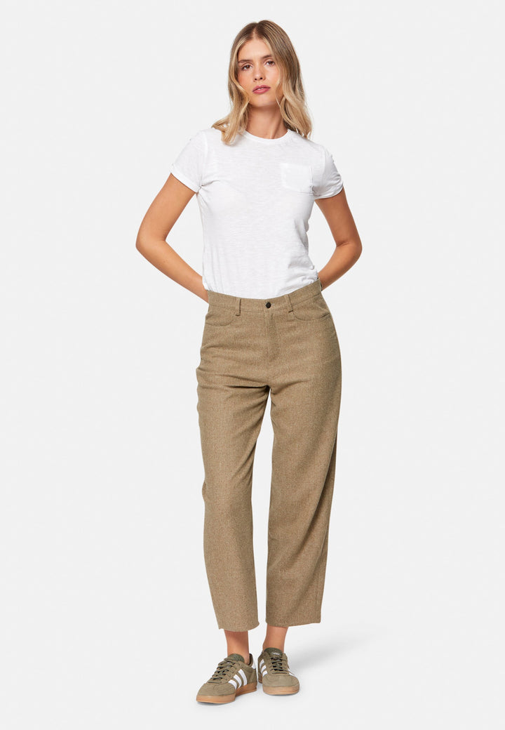 woman wearing white t-shirt and wool brown trouser