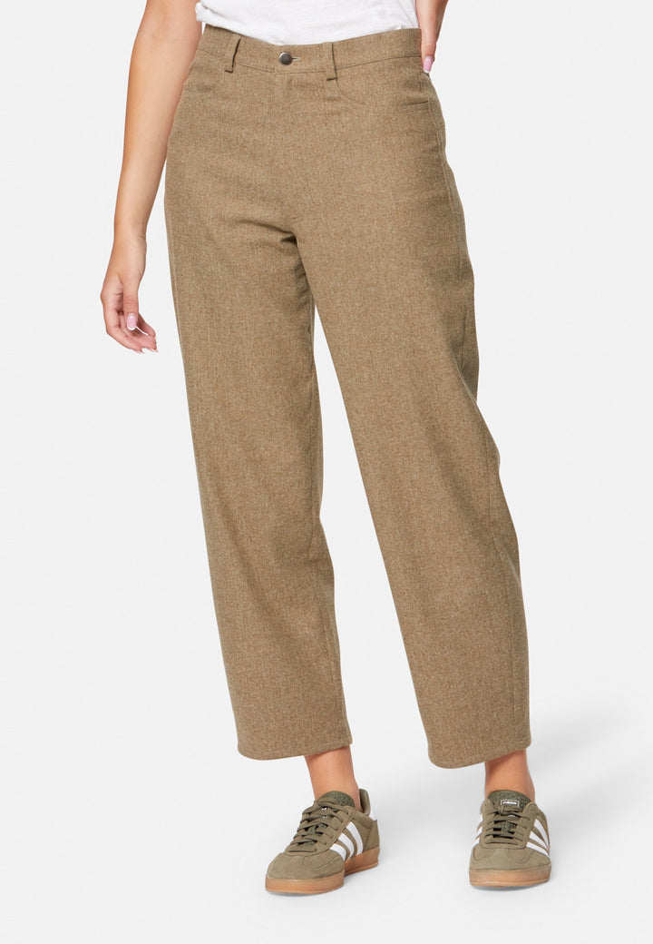 woman wearing white t-shirt and wool brown trouser