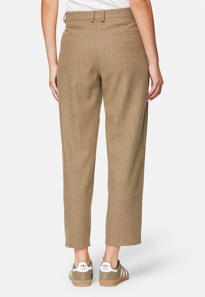 woman wearing white t-shirt and wool brown trouser