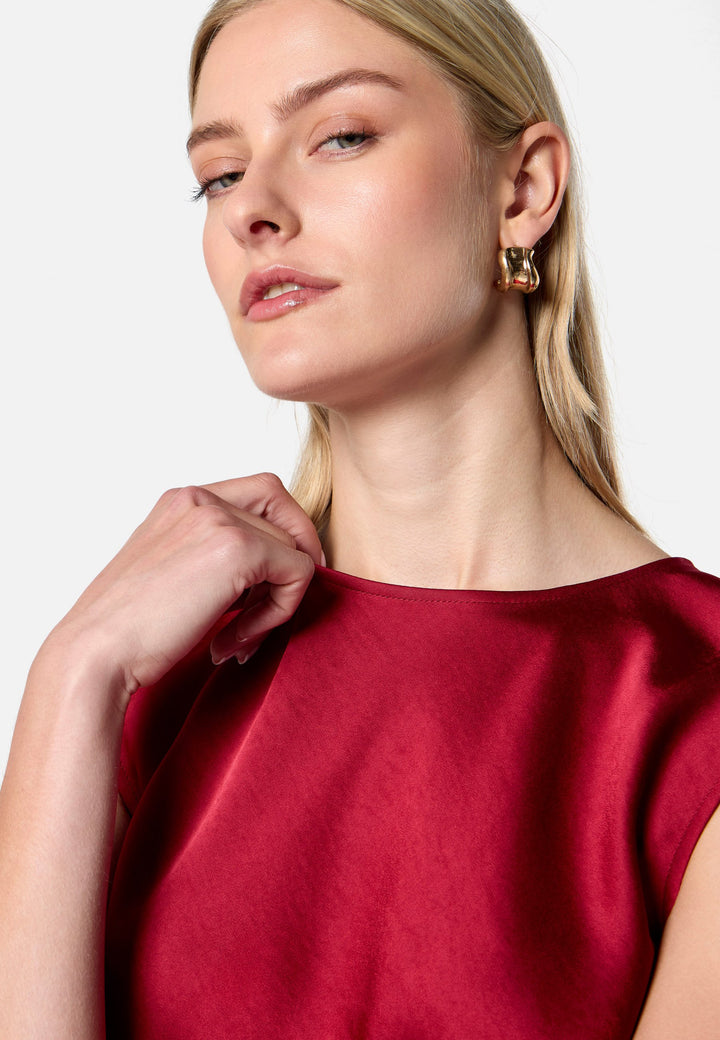 model wearing Nicki Ruby Red Satin Top