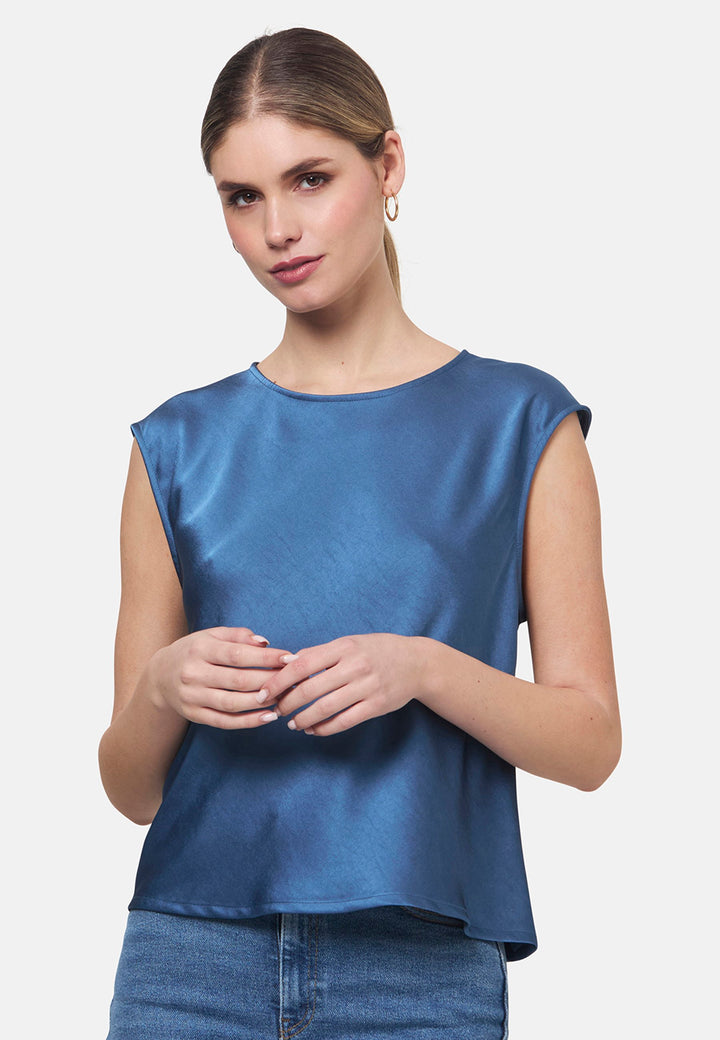 Woman wearing silk-touch satin in storm blue top
