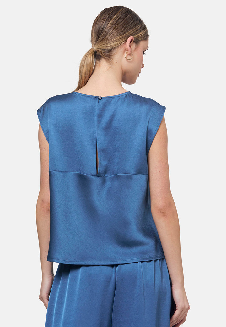 Woman wearing silk-touch satin in storm blue top