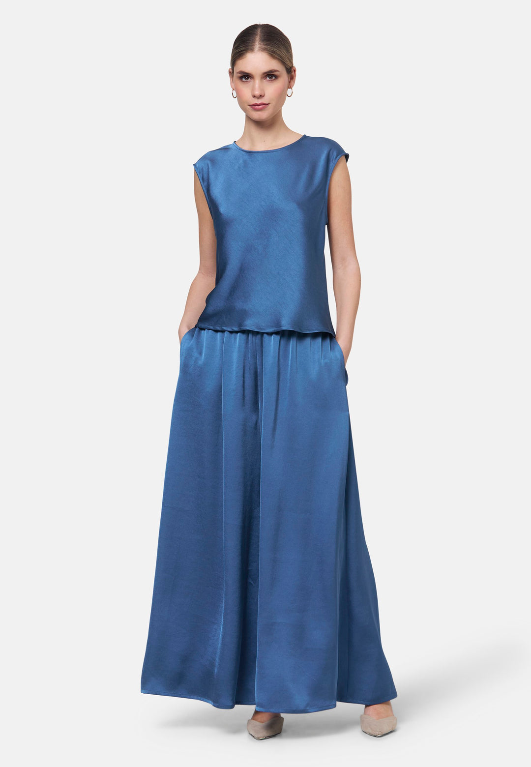 Woman wearing silk-touch satin in storm blue top
