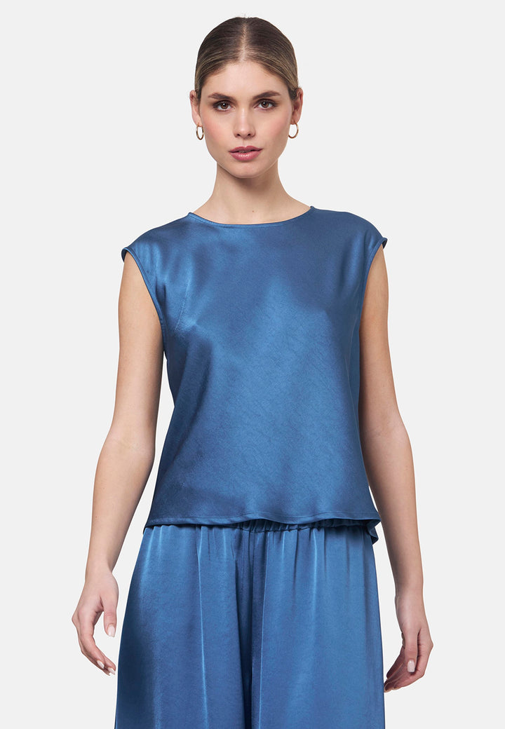 Woman wearing silk-touch satin in storm blue top