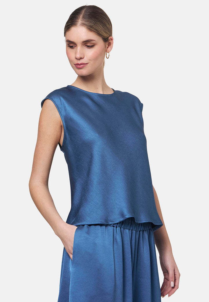 Woman wearing silk-touch satin in storm blue top