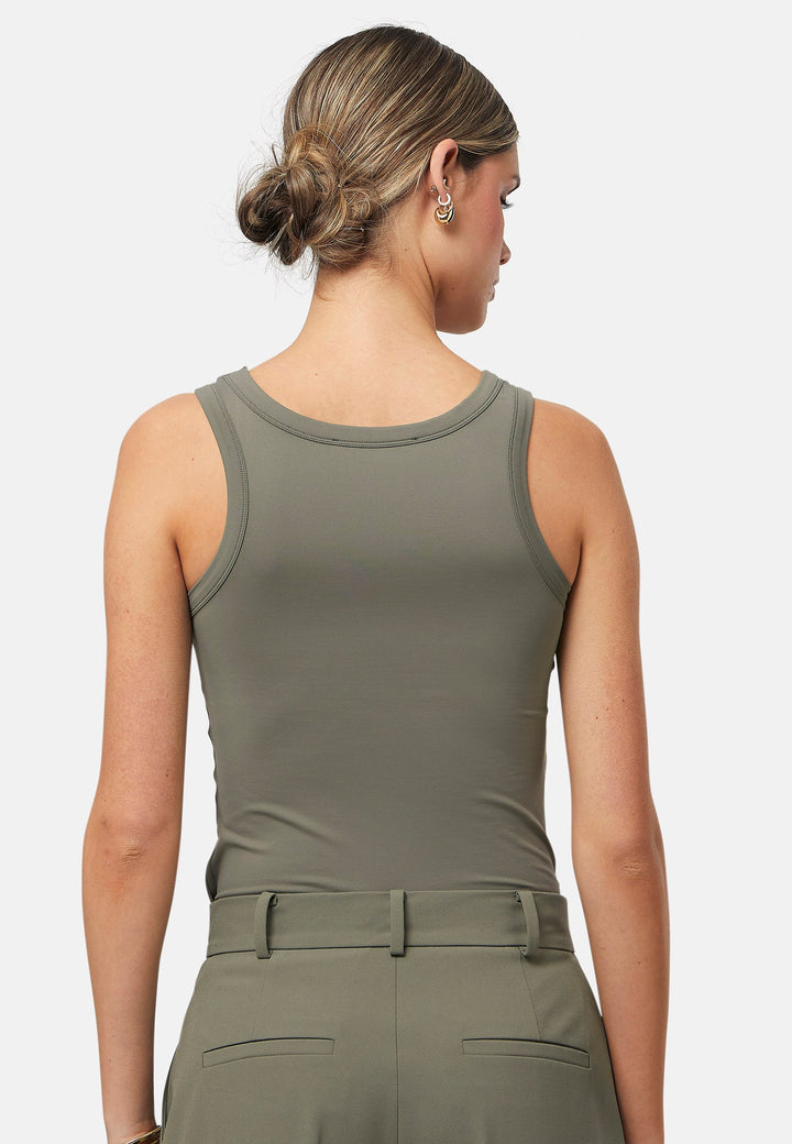 Hit refresh on your everyday essentials with the olive Norah tank Top. Crafted in a luxe stretch jersey. Features round neckline and muscle back silhouette.