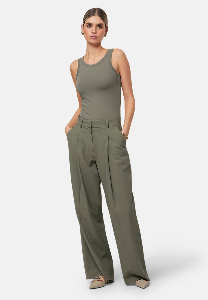 Hit refresh on your everyday essentials with the olive Norah tank Top. Crafted in a luxe stretch jersey. Features round neckline and muscle back silhouette.