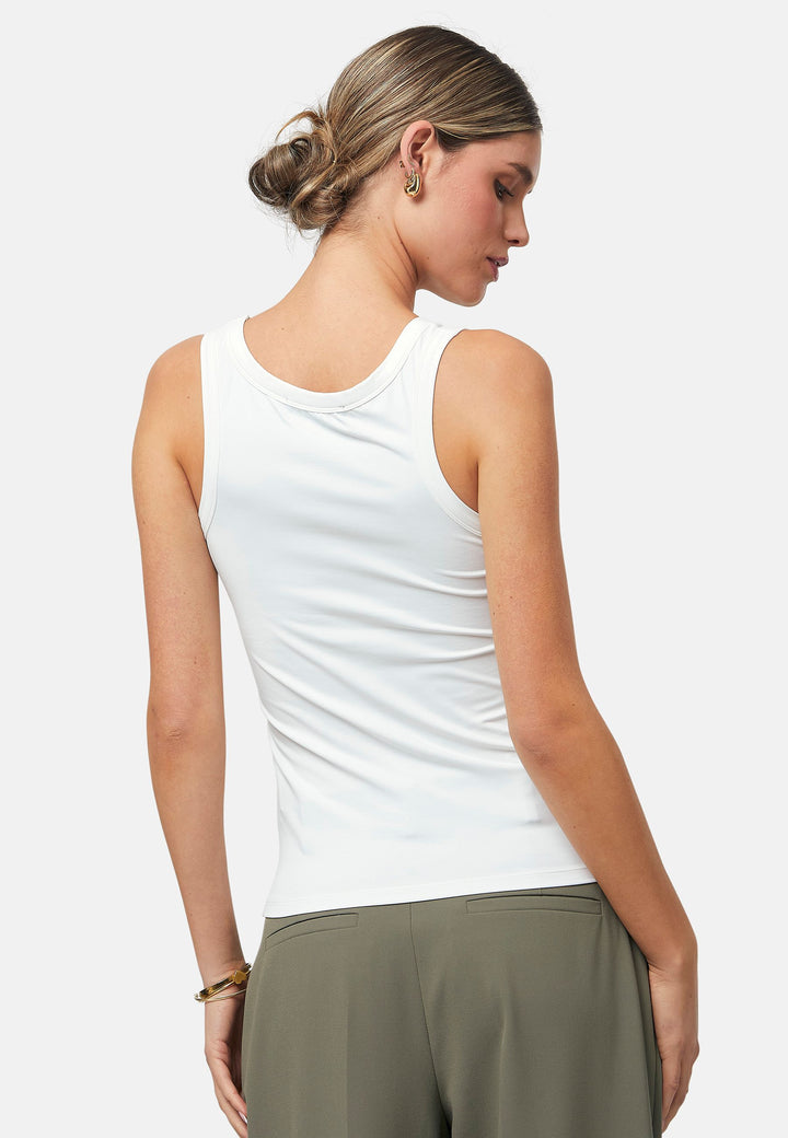 Hit refresh on your everyday essentials with the white Norah tank Top. Crafted in a luxe stretch jersey. Features round neckline and muscle back silhouette.