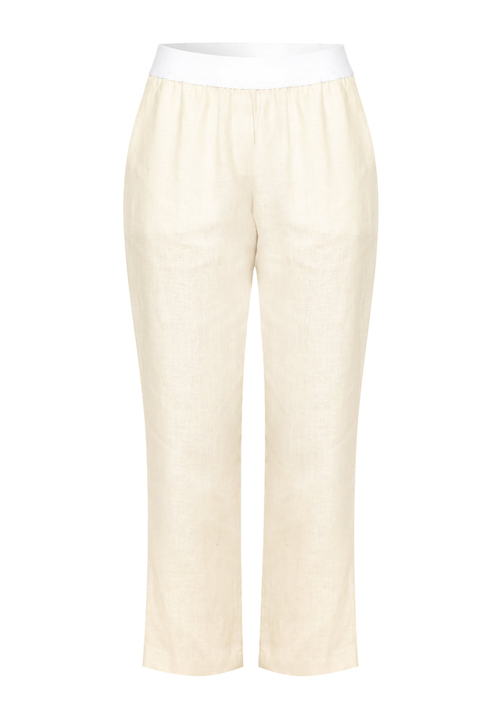 These relaxed-fit trousers in a buttermilk cream are crafted from breathable Irish linen, making them perfect for casual, everyday wear. Featuring an elasticated waistband and practical back pocket, they offer both comfort and functionality. Pair them with sandals, the Cassie jacket and a simple top for a laid-back, effortless look.