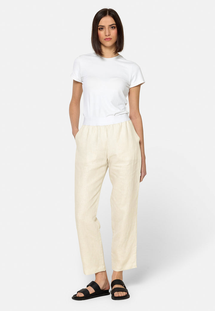 These relaxed-fit trousers in a buttermilk cream are crafted from breathable Irish linen, making them perfect for casual, everyday wear. Featuring an elasticated waistband and practical back pocket, they offer both comfort and functionality. Pair them with sandals, the Cassie jacket and a simple top for a laid-back, effortless look.