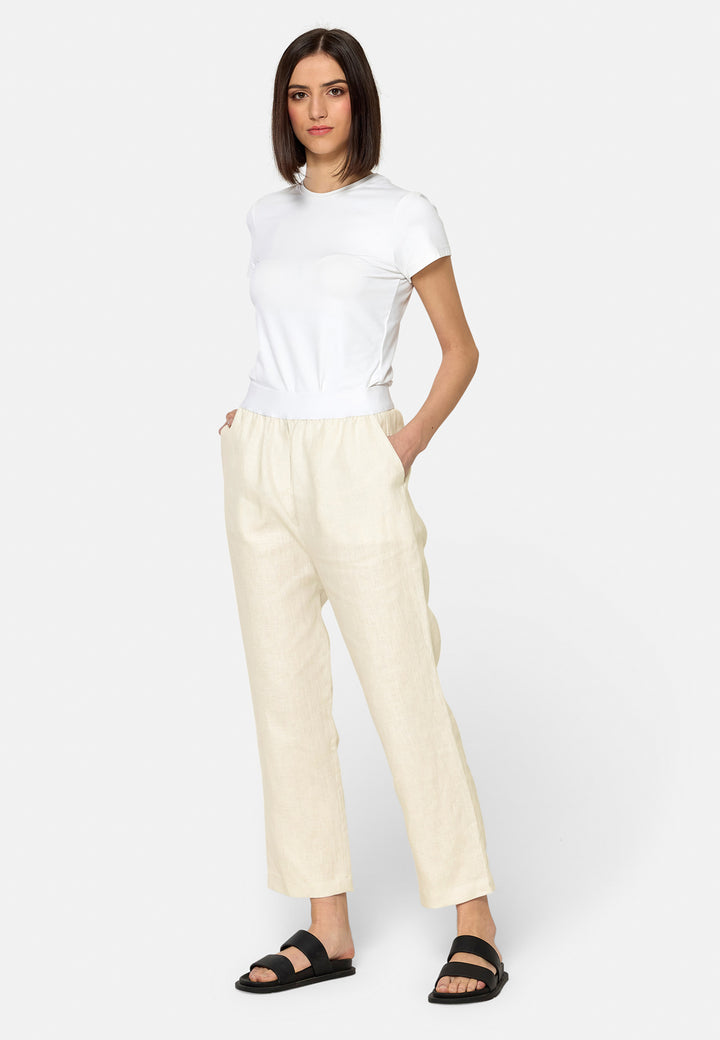 These relaxed-fit trousers in a buttermilk cream are crafted from breathable Irish linen, making them perfect for casual, everyday wear. Featuring an elasticated waistband and practical back pocket, they offer both comfort and functionality. Pair them with sandals, the Cassie jacket and a simple top for a laid-back, effortless look.