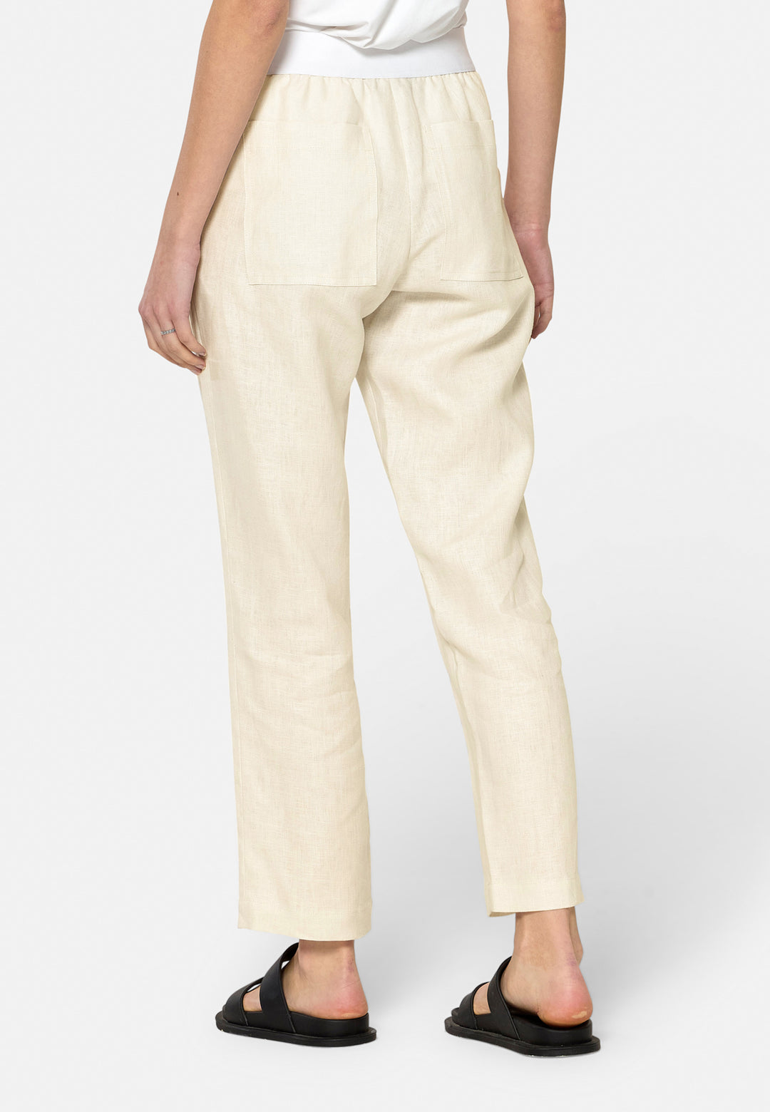 These relaxed-fit trousers in a buttermilk cream are crafted from breathable Irish linen, making them perfect for casual, everyday wear. Featuring an elasticated waistband and practical back pocket, they offer both comfort and functionality. Pair them with sandals, the Cassie jacket and a simple top for a laid-back, effortless look.