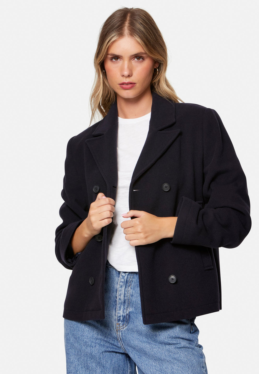 woman wearing double breast cashmere pea coat in navy