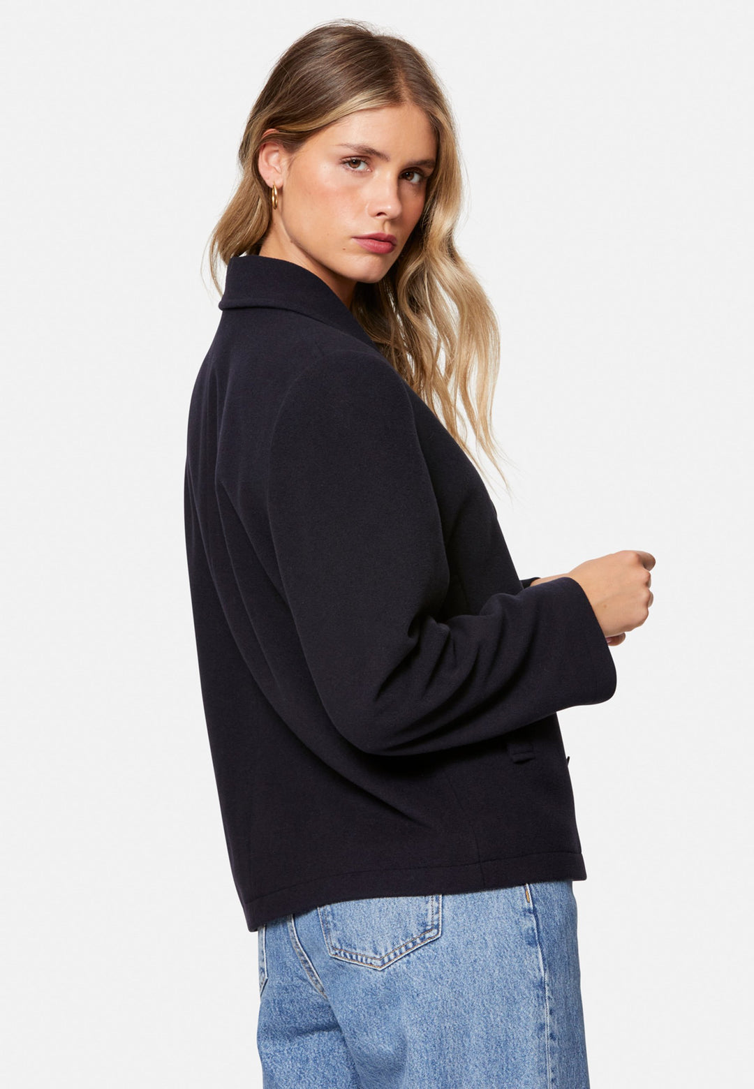 woman wearing double breast cashmere pea coat in navy