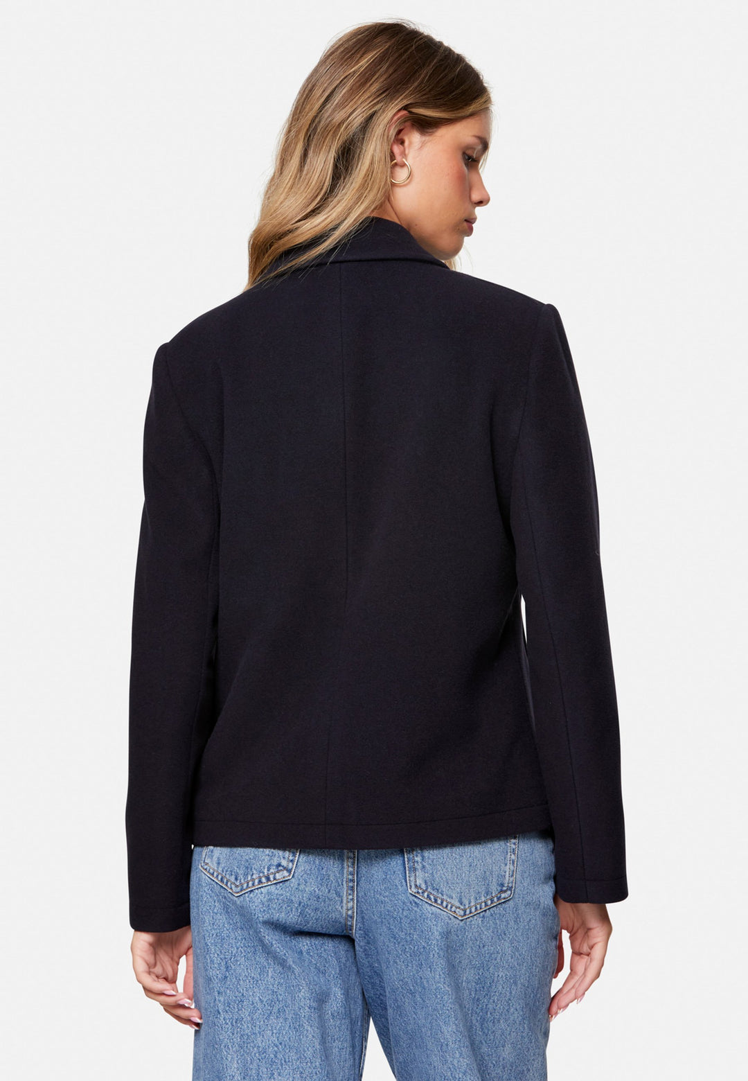 woman wearing double breast cashmere pea coat in navy