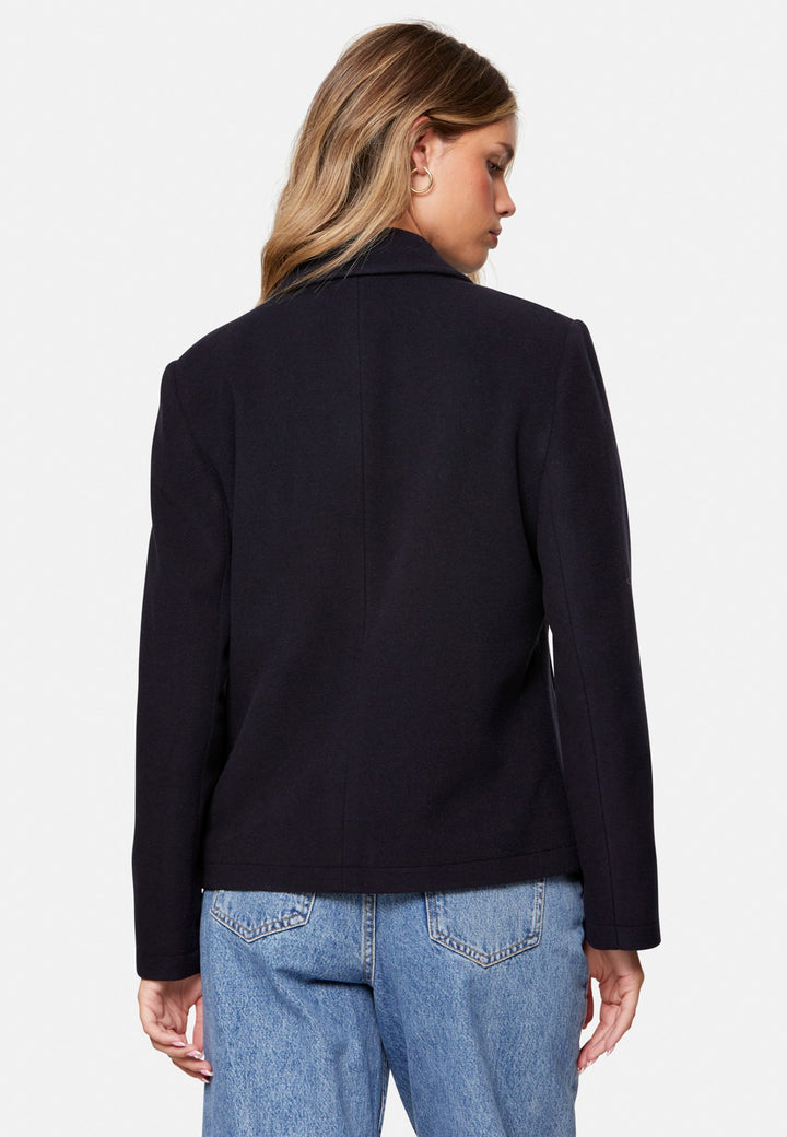 woman wearing double breast cashmere pea coat in navy