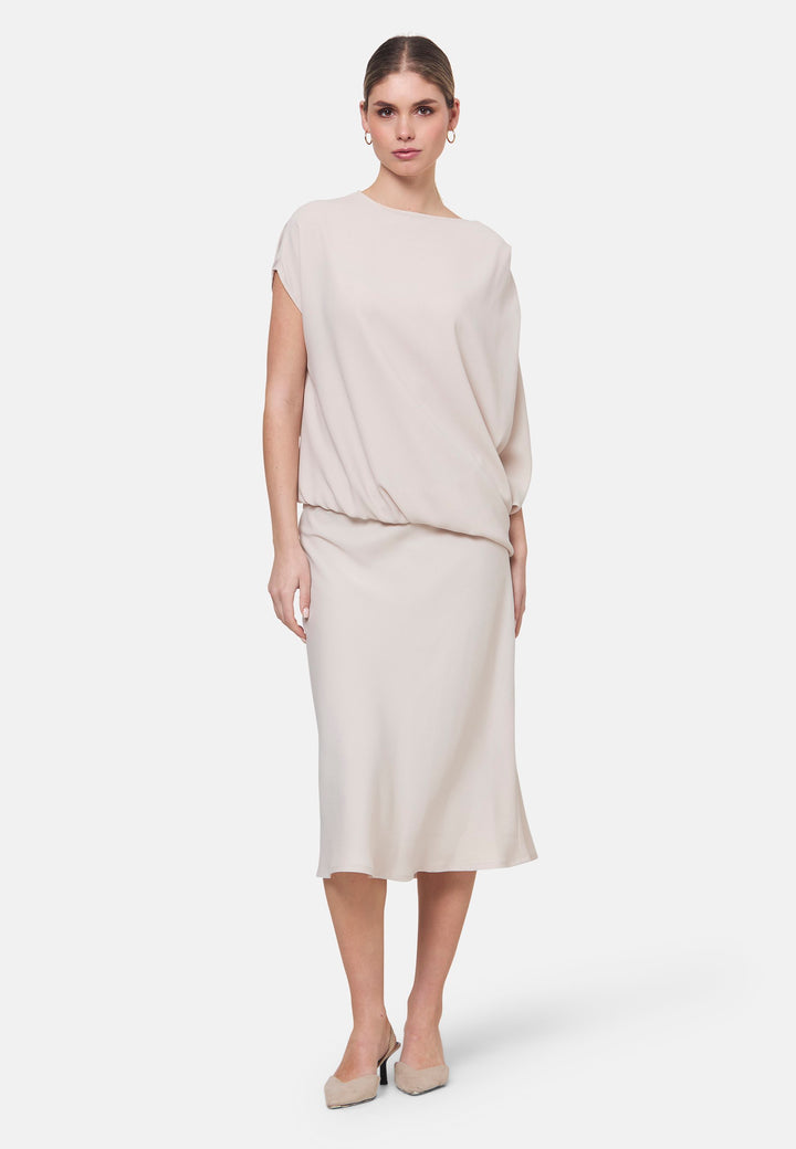 Woman wearing natural pearl dress