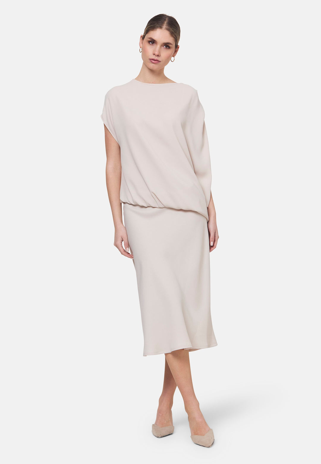 Woman wearing natural pearl dress