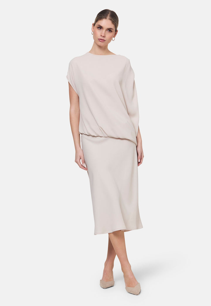 Woman wearing natural pearl dress