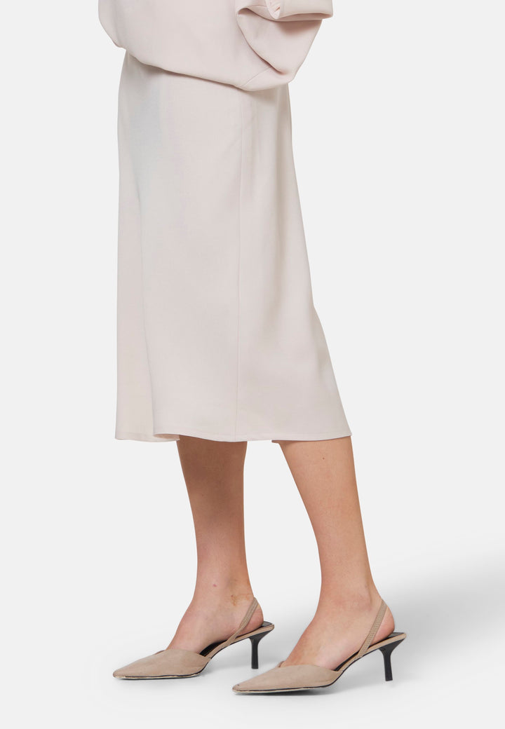 Woman wearing natural pearl dress