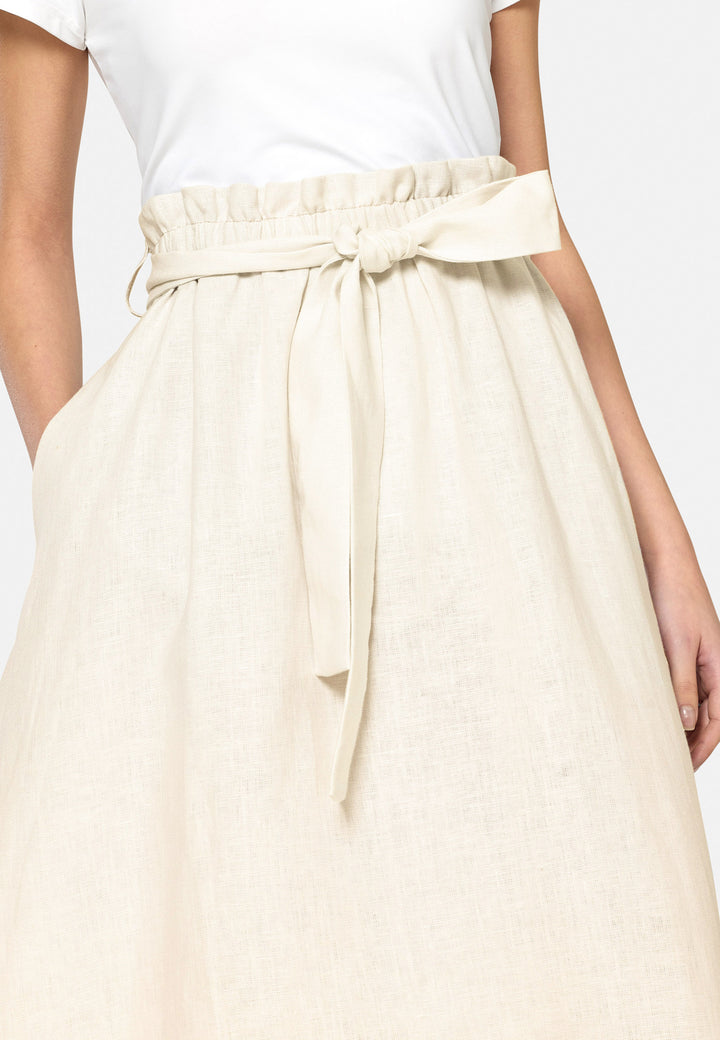 Meg, an easy-fitting, pull-on linen skirt that embraces a laid-back spirit. A piece you can't travel without. Designed to sit on the high waist for a flattering fit. Features a detachable belt. Paper bag elasticated waist for all day comfort. Cut from a breathable Irish linen. Pair it with a simple tee and the co-ordinating Cassie boyfriend-blazer with trainers for a chic and contemporary look.